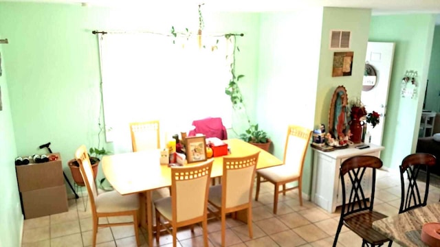 3407 Fountainbleau Dr, Hazel Crest, IL 60429 - dining room with light tile patterned floors and a chandelier