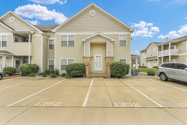 1352 Mariner Way Unit 0, Champaign, IL 61822 - townhome / multi-family property with uncovered parking and central AC unit