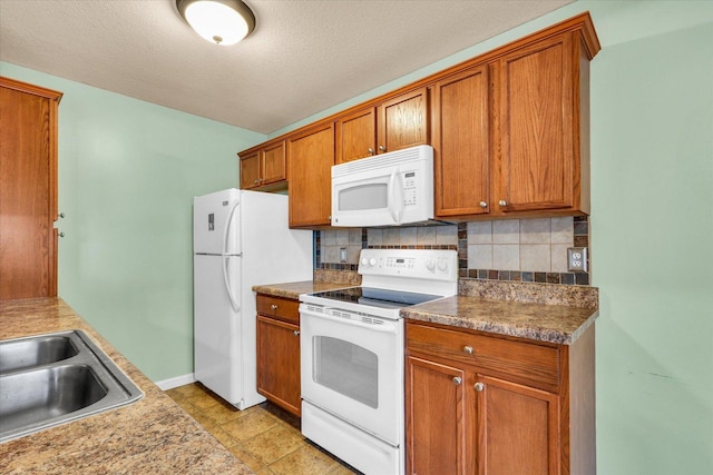1352 Mariner Way Unit 0, Champaign, IL 61822 - kitchen featuring white appliances, tasteful backsplash, brown cabinetry, a sink, and baseboards