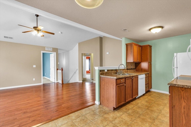 1352 Mariner Way Unit 0, Champaign, IL 61822 - kitchen with a sink, white appliances, brown cabinets, open floor plan, and a peninsula