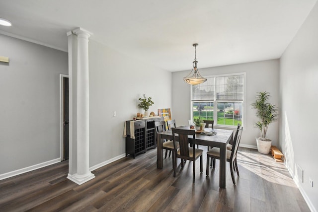 1159 Clover Hill Ln, Elgin, IL 60120 - dining space featuring ornate columns, dark wood-style floors, and baseboards