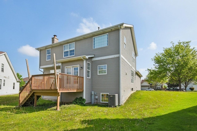 1159 Clover Hill Ln, Elgin, IL 60120 - back of house with a chimney, a wooden deck, a yard, central AC unit, and stairs