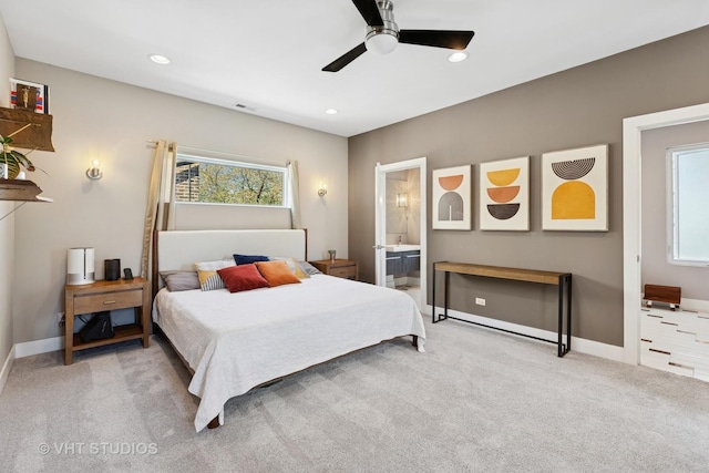 bedroom featuring multiple windows, light carpet, baseboards, and recessed lighting