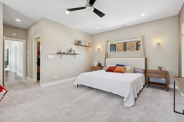 bedroom featuring light colored carpet, recessed lighting, baseboards, and ceiling fan