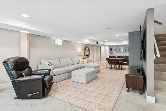 living room featuring light colored carpet, stairway, and recessed lighting