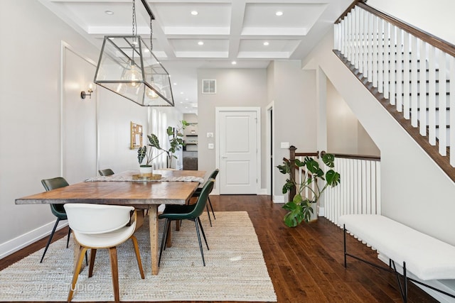 dining room with coffered ceiling, dark wood finished floors, beam ceiling, recessed lighting, and a high ceiling