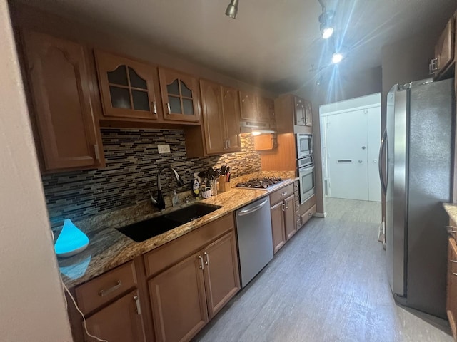 18840 May Ave, Homewood, IL 60430 - kitchen featuring appliances with stainless steel finishes, backsplash, light stone countertops, and glass insert cabinets