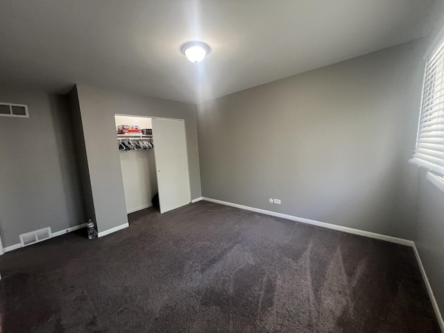 18840 May Ave, Homewood, IL 60430 - unfurnished bedroom featuring dark carpet and a closet
