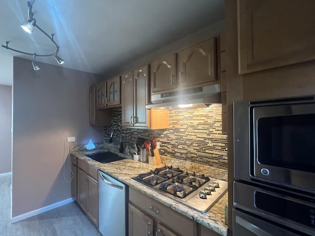18840 May Ave, Homewood, IL 60430 - kitchen with appliances with stainless steel finishes, under cabinet range hood, decorative backsplash, and light stone counters