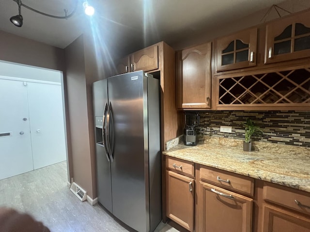 18840 May Ave, Homewood, IL 60430 - kitchen with stainless steel fridge, tasteful backsplash, light wood-style floors, and glass insert cabinets