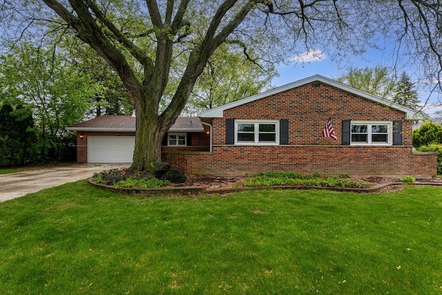 937 Twilight Ln, Wheeling, IL 60090 - view of front of house with brick siding, concrete driveway, an attached garage, and a front yard