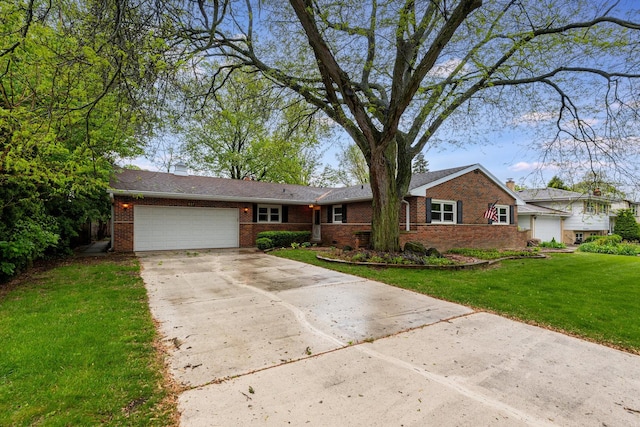 937 Twilight Ln, Wheeling, IL 60090 - view of front of home with brick siding, an attached garage, concrete driveway, a front yard, and a chimney