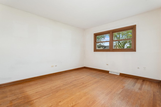 937 Twilight Ln, Wheeling, IL 60090 - empty room featuring baseboards and light wood-type flooring