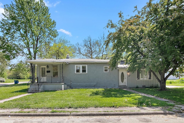 1990 Patrick Ave, Kankakee, IL 60901 - view of front facade featuring a front yard and stucco siding