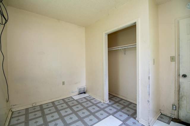 1990 Patrick Ave, Kankakee, IL 60901 - unfurnished bedroom featuring a closet and light floors