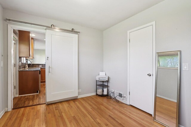 110 W Maude Ave, Arlington Heights, IL 60004 - unfurnished bedroom with light wood-style flooring, a sink, and baseboards