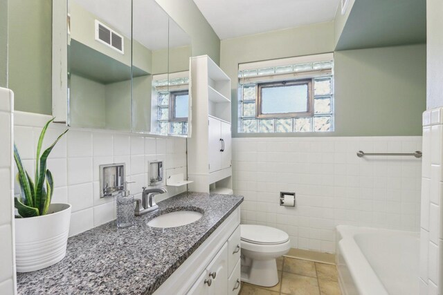 110 W Maude Ave, Arlington Heights, IL 60004 - full bathroom with tile walls, toilet, a bath, vanity, and a wainscoted wall