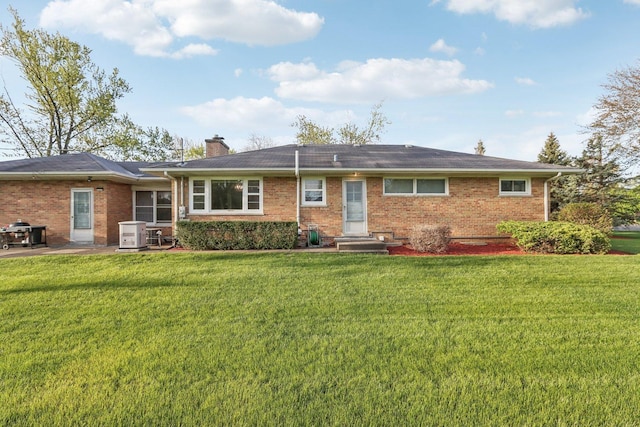 110 W Maude Ave, Arlington Heights, IL 60004 - rear view of property with a chimney, brick siding, a lawn, and a patio
