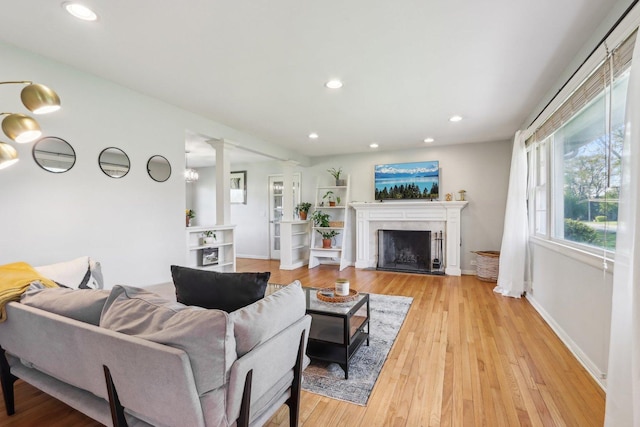 110 W Maude Ave, Arlington Heights, IL 60004 - living area featuring recessed lighting, light wood finished floors, a premium fireplace, and ornate columns
