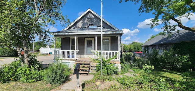 1128 N Hickory St, Joliet, IL 60435 - shotgun-style home with covered porch
