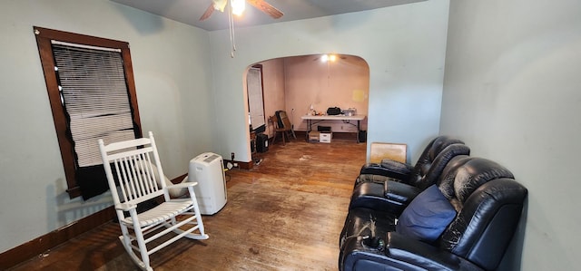 1128 N Hickory St, Joliet, IL 60435 - living area featuring arched walkways, a ceiling fan, and hardwood / wood-style floors