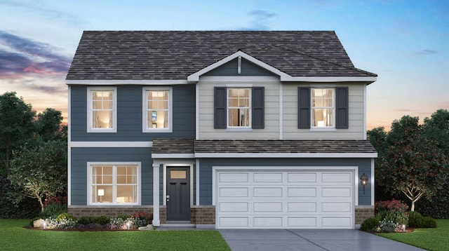 6902 Willow Dr, Wonder Lake, IL 60097 - traditional-style house with concrete driveway, a lawn, an attached garage, roof with shingles, and stone siding