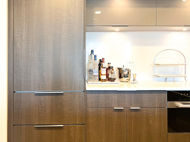 indoor dry bar featuring dishwasher