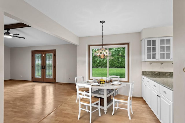 1836 71st St, Woodridge, IL 60517 - dining area with healthy amount of natural light, light wood-type flooring, baseboards, a chandelier, and beamed ceiling