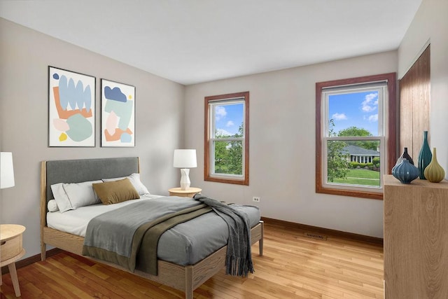 1836 71st St, Woodridge, IL 60517 - bedroom featuring baseboards and light wood finished floors