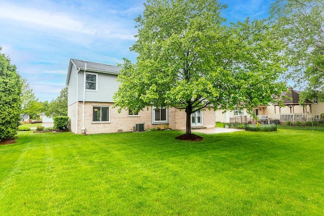 1836 71st St, Woodridge, IL 60517 - back of property featuring central AC, brick siding, and a patio area