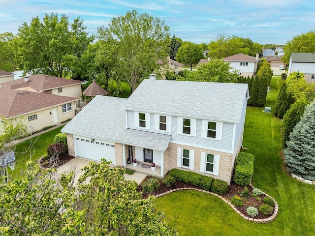 1836 71st St, Woodridge, IL 60517 - view of front of home with a garage, a front lawn, concrete driveway, and a chimney