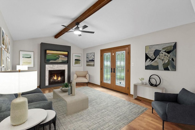 1836 71st St, Woodridge, IL 60517 - living room featuring wood finished floors, ceiling fan, a tile fireplace, french doors, and baseboards