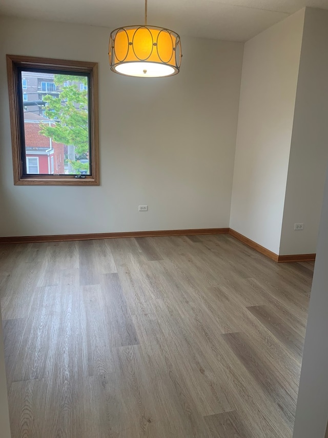 1327 E Washington St Unit 207, Des Plaines, IL 60016 - unfurnished room featuring wood finished floors and baseboards