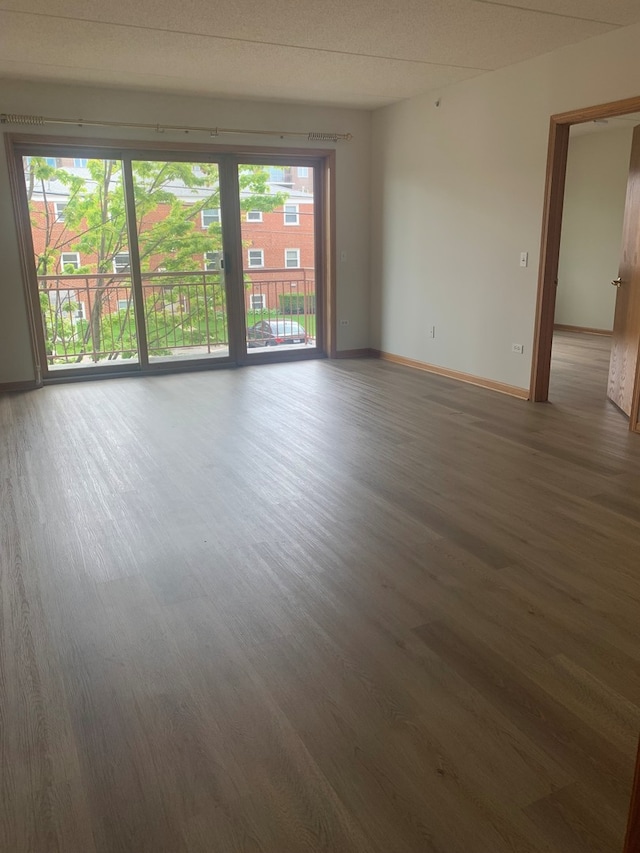 1327 E Washington St Unit 207, Des Plaines, IL 60016 - unfurnished room featuring wood finished floors and baseboards