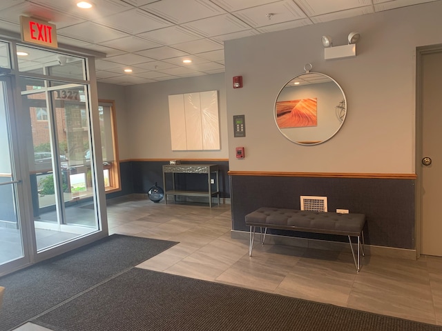 1327 E Washington St Unit 207, Des Plaines, IL 60016 - building lobby with a wainscoted wall and a drop ceiling