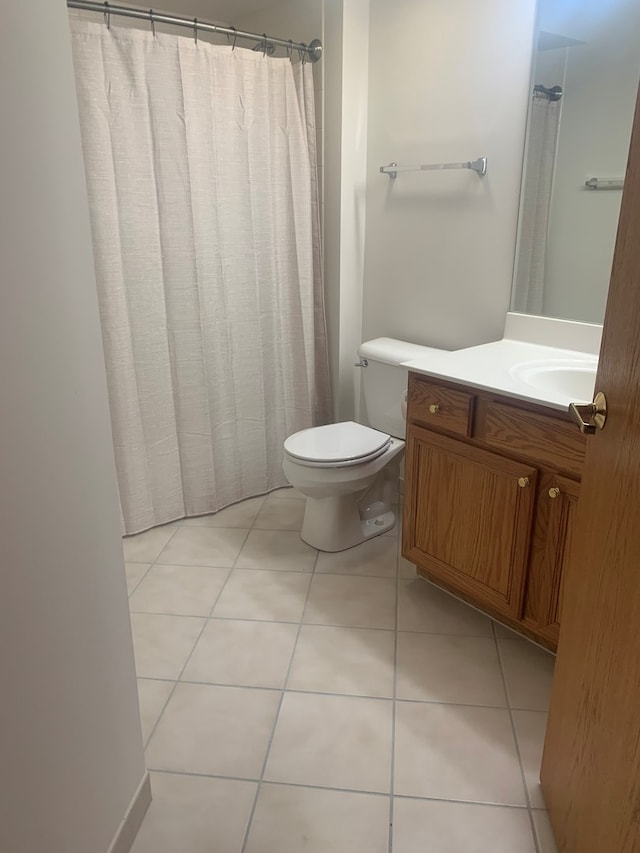 1327 E Washington St Unit 207, Des Plaines, IL 60016 - bathroom featuring toilet, vanity, tile patterned floors, and a shower with shower curtain