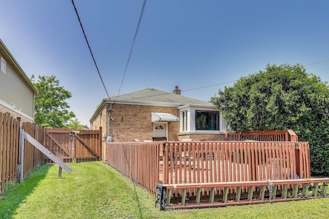 7657 N Osceola Ave, Niles, IL 60714 - back of house with brick siding, a deck, a shingled roof, and a gate