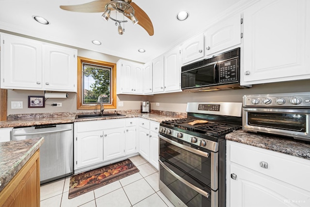 19634 Patricia Ln, Mokena, IL 60448 - kitchen featuring appliances with stainless steel finishes, a sink, ceiling fan, light tile patterned floors, and white cabinets