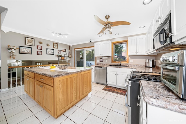 19634 Patricia Ln, Mokena, IL 60448 - kitchen featuring appliances with stainless steel finishes, a sink, ornamental molding, a center island, and light tile patterned floors