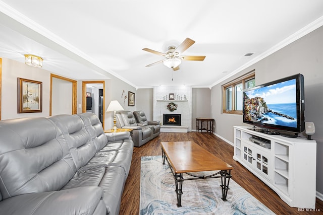 19634 Patricia Ln, Mokena, IL 60448 - living area with ceiling fan, wood finished floors, crown molding, a brick fireplace, and baseboards