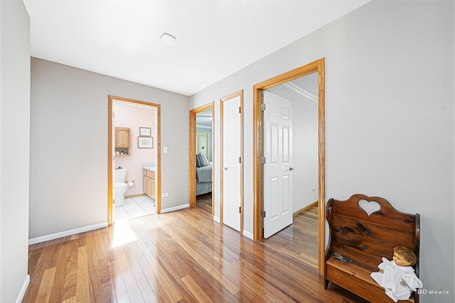 19634 Patricia Ln, Mokena, IL 60448 - bedroom featuring light wood-style floors, baseboards, and ensuite bathroom