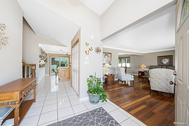 19634 Patricia Ln, Mokena, IL 60448 - foyer entrance featuring stairs, healthy amount of natural light, light tile patterned flooring, baseboards, and high vaulted ceiling