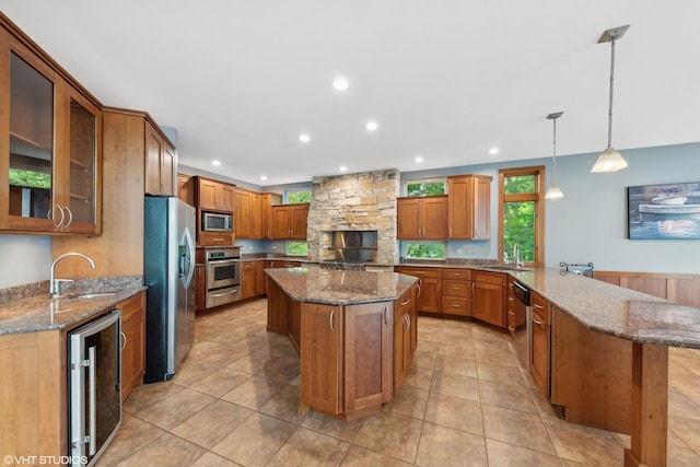 250 Whitney Rd, Lake Zurich, IL 60047 - kitchen with appliances with stainless steel finishes, beverage cooler, a sink, a peninsula, and recessed lighting