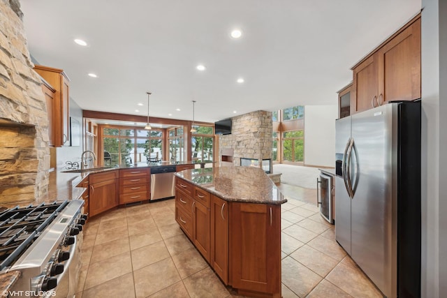 250 Whitney Rd, Lake Zurich, IL 60047 - kitchen featuring appliances with stainless steel finishes, a sink, dark stone counters, healthy amount of natural light, and recessed lighting