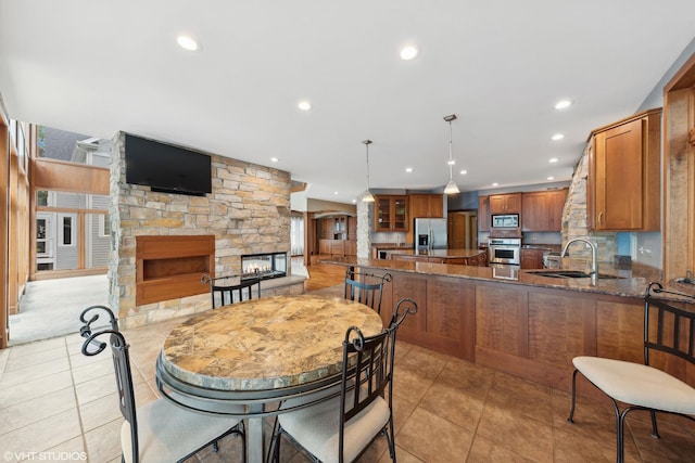 250 Whitney Rd, Lake Zurich, IL 60047 - dining area with a fireplace, recessed lighting, and light tile patterned flooring