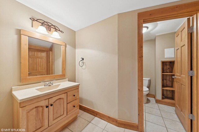 250 Whitney Rd, Lake Zurich, IL 60047 - half bath featuring toilet, tile patterned floors, vanity, and baseboards