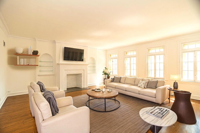 6048 N Rockwell Ave Unit 2, Chicago, IL 60659 - living room with wood finished floors, crown molding, a brick fireplace, and built in features