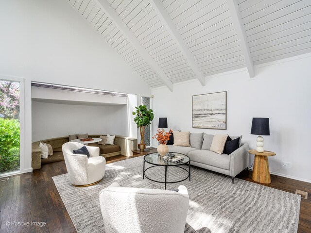 living room with high vaulted ceiling, plenty of natural light, wood finished floors, beamed ceiling, and baseboards