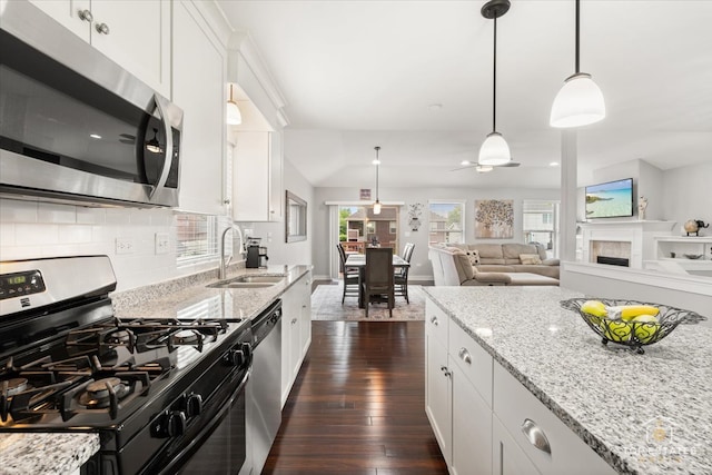 1308 Burry St, Joliet, IL 60435 - kitchen with stainless steel appliances, a sink, dark wood-type flooring, and white cabinetry