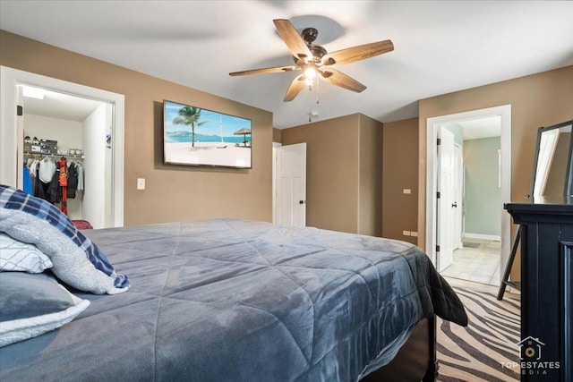 1308 Burry St, Joliet, IL 60435 - carpeted bedroom with a walk in closet, ceiling fan, a closet, and ensuite bath